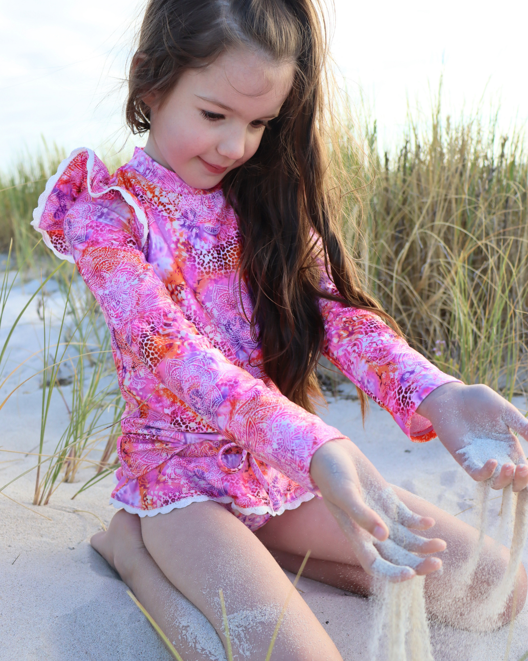 girls wearing UPF50+ swimwear on the beach