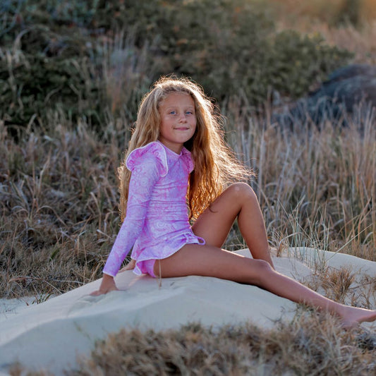 Uniquely designed girls swimsuit, featuring a closed back rash top