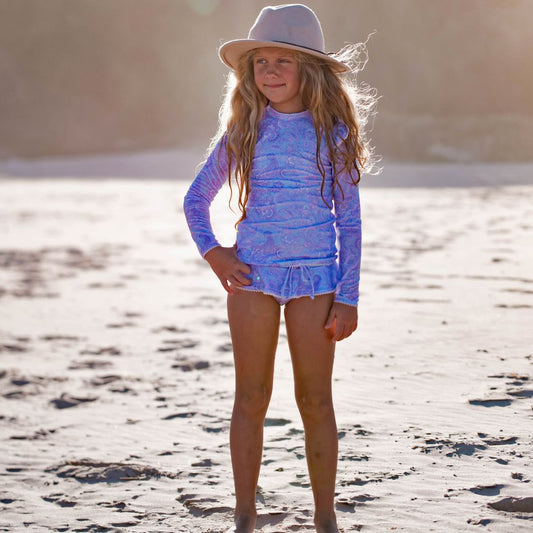 Uniquely designed girls swimsuit, featuring a closed back rash top