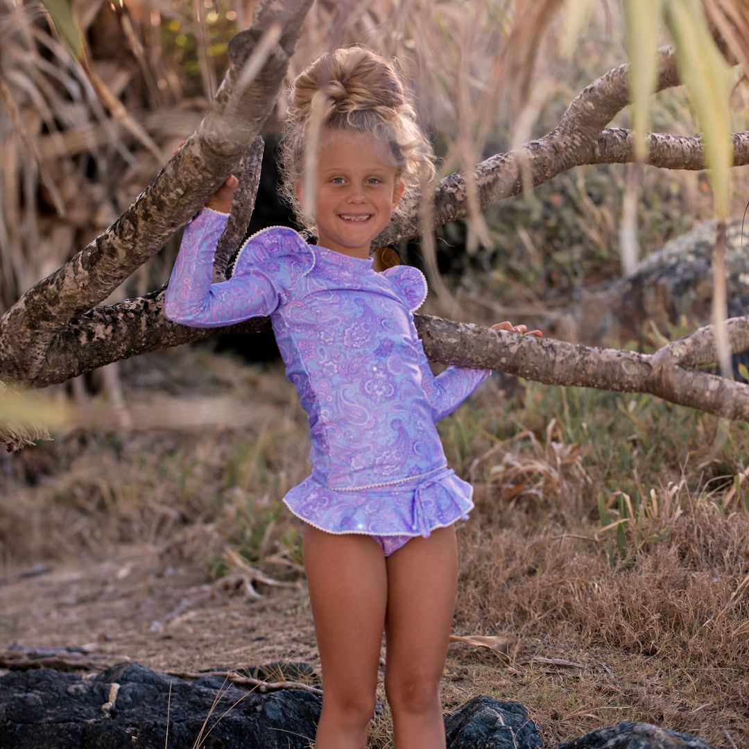 Uniquely designed girls swimsuit, featuring a closed back rash top