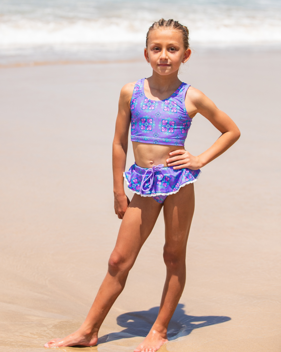 girl in tween bikini on beach